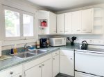 Full kitchen with microwave and coffee maker